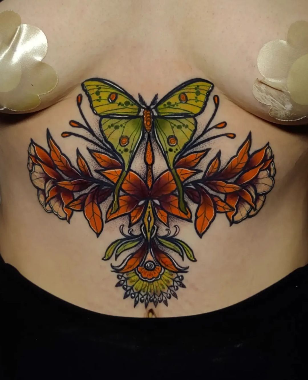 Luna moth and florals sternum tattoo, symmetrical