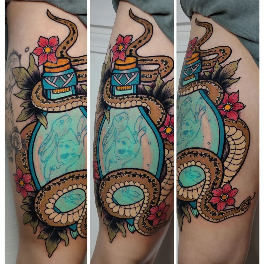 Serpent coiled around an elixir bottle, color thigh tattoo